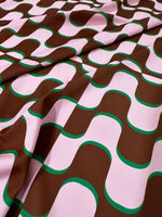 Vintage fabric with pink and brown wave pattern inspired by 60s and 70s style, 150cm wide