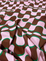 Vintage pink and brown wave pattern fabric with 60s and 70s retro design