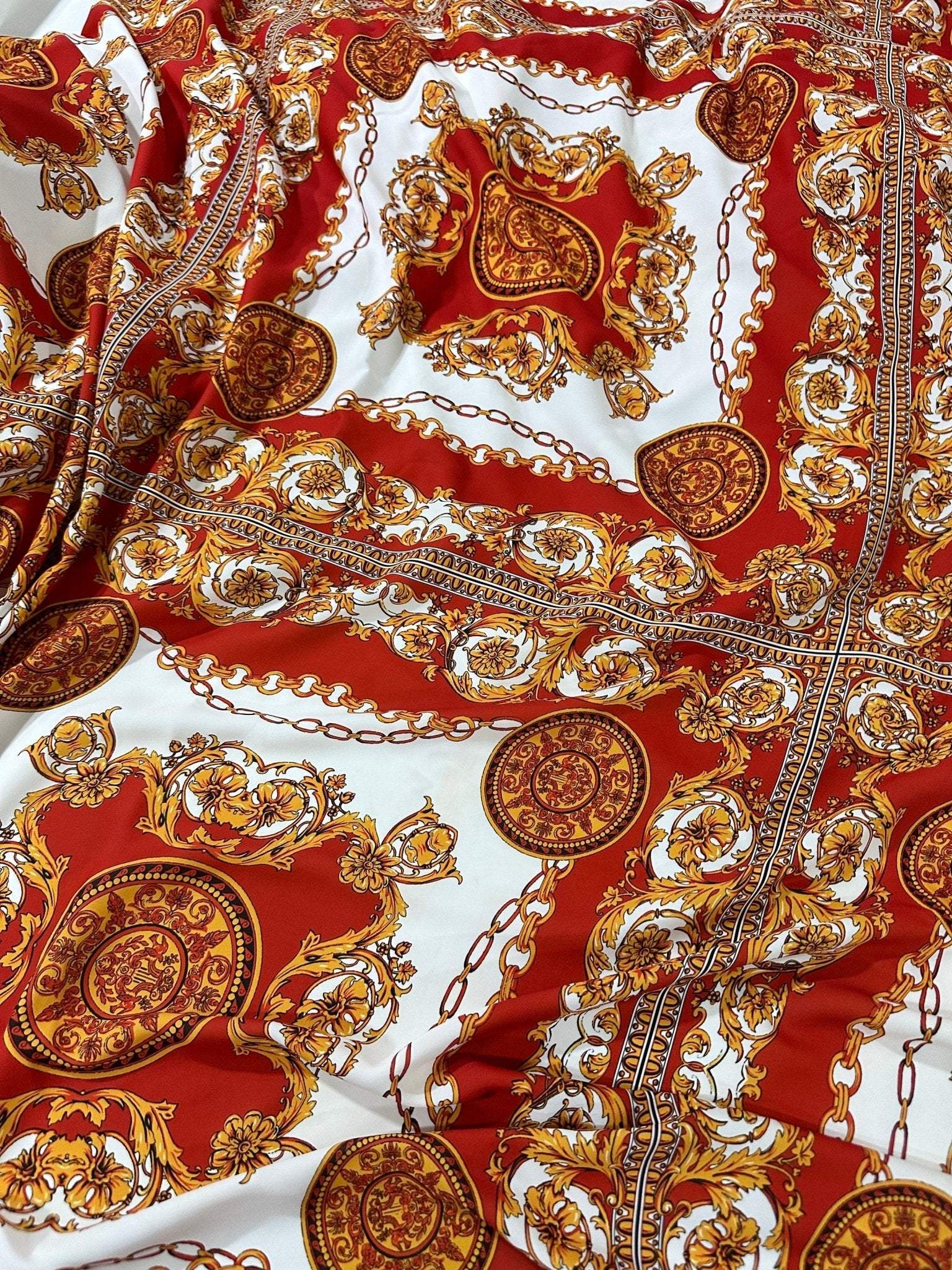 Vintage Baroque pattern fabric with ornate gold and red upholstery design on white background