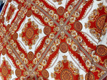 Vintage Baroque pattern fabric with intricate gold and red ornate design on white background, ideal for upholstery and decor projects.