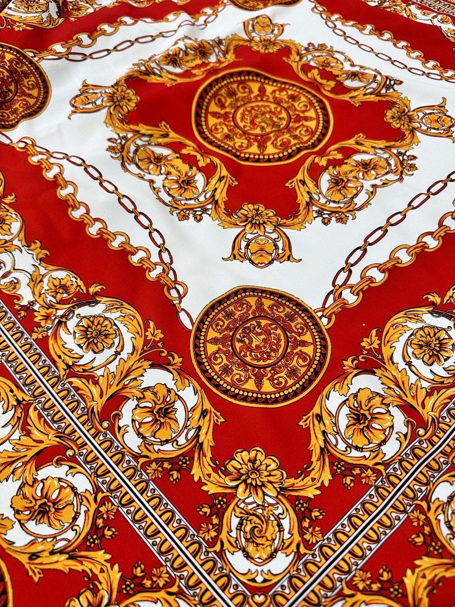 Vintage Baroque pattern fabric with gold and red ornate upholstery design featuring intricate scrolls and medallions