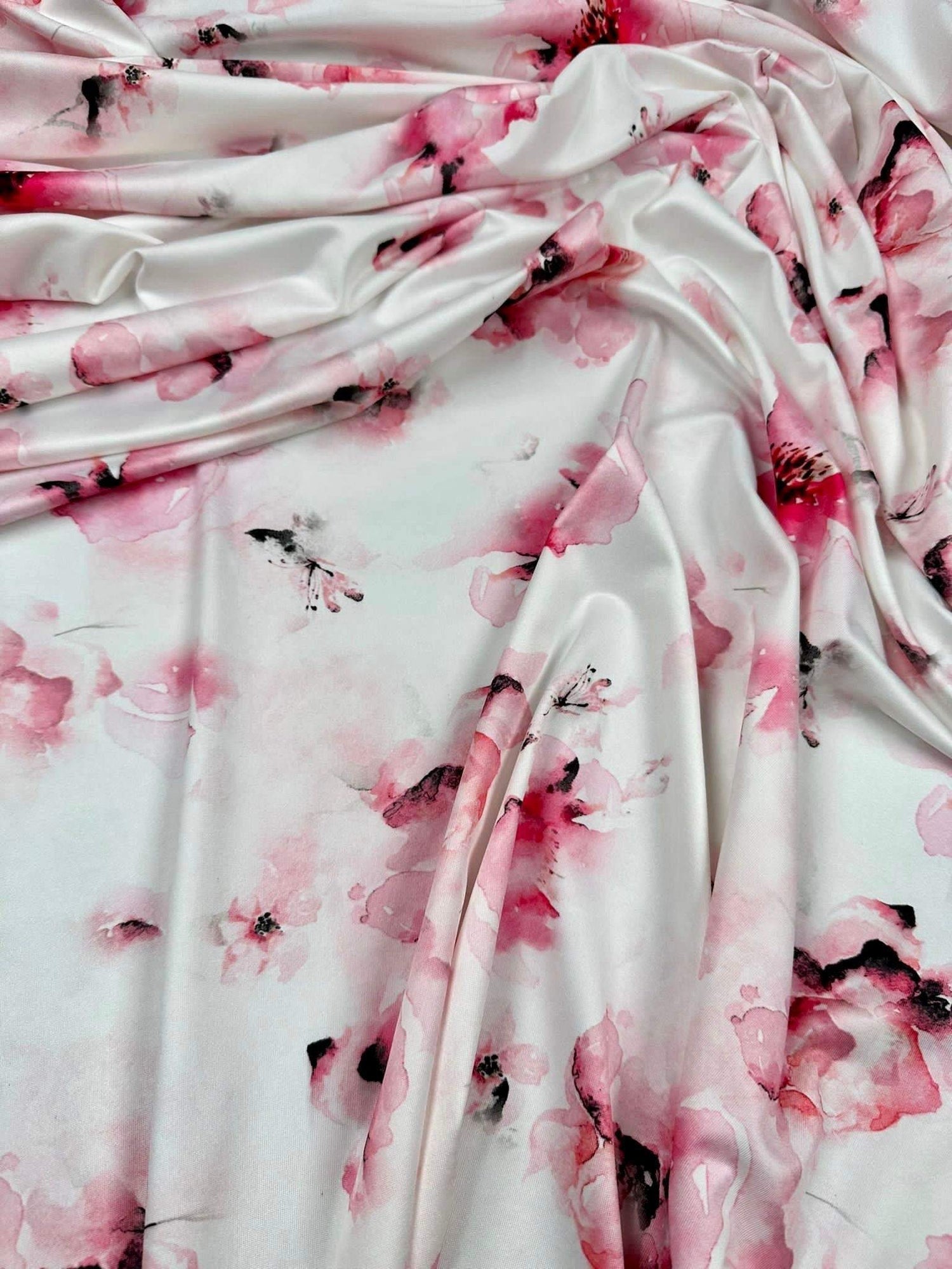 Soft watercolor floral fabric with pink and white pattern for sewing and crafting projects