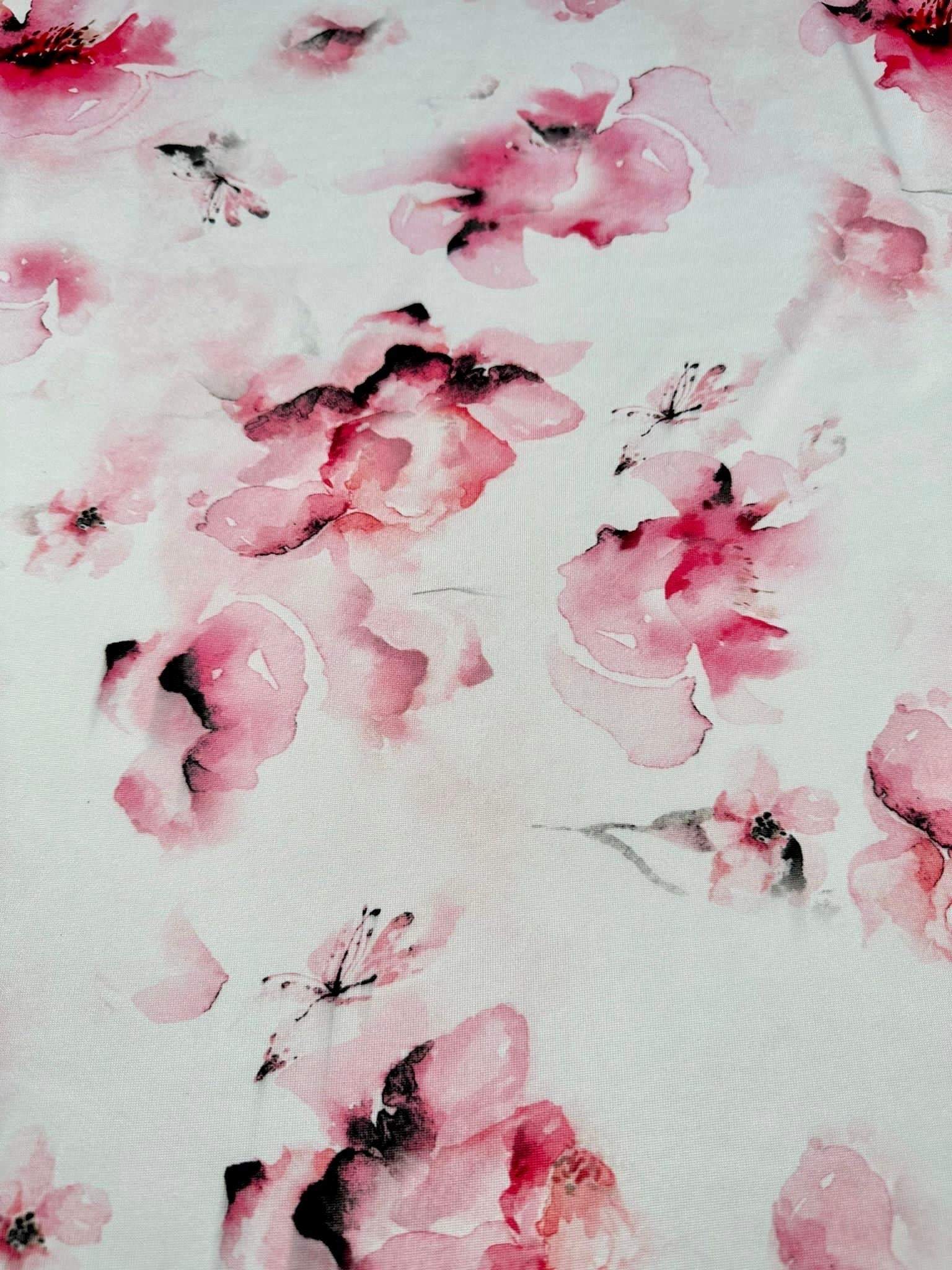 Pink and white watercolor floral fabric with elegant petals and soft brush strokes for sewing and crafting projects