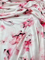 Soft watercolor floral fabric with pink and white floral pattern, ideal for sewing and crafting projects, fabric width 150cm.