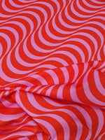 red pink striped wave pattern fabric textile for sewing quilting and upholstery projects