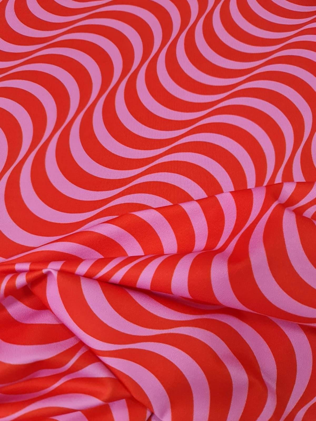 red pink striped wave pattern fabric textile for sewing quilting and upholstery projects