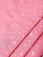 White Stars Pink Poplin cotton fabric with white star pattern on pink background, 170 cm wide, suitable for clothing and home decor.
