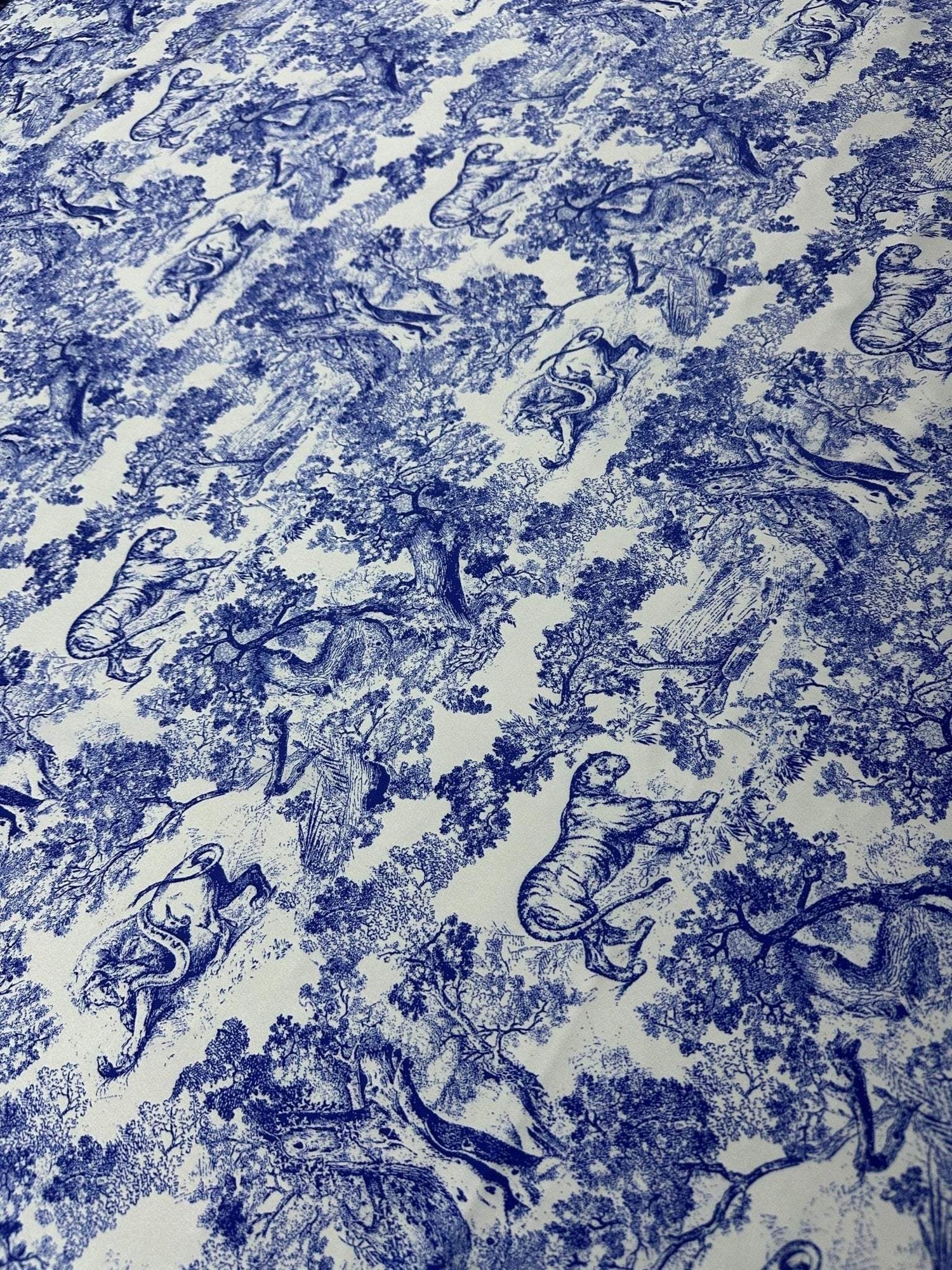 Blue Wild Forest Pattern Fabric featuring detailed animal and tree illustrations on high-quality material