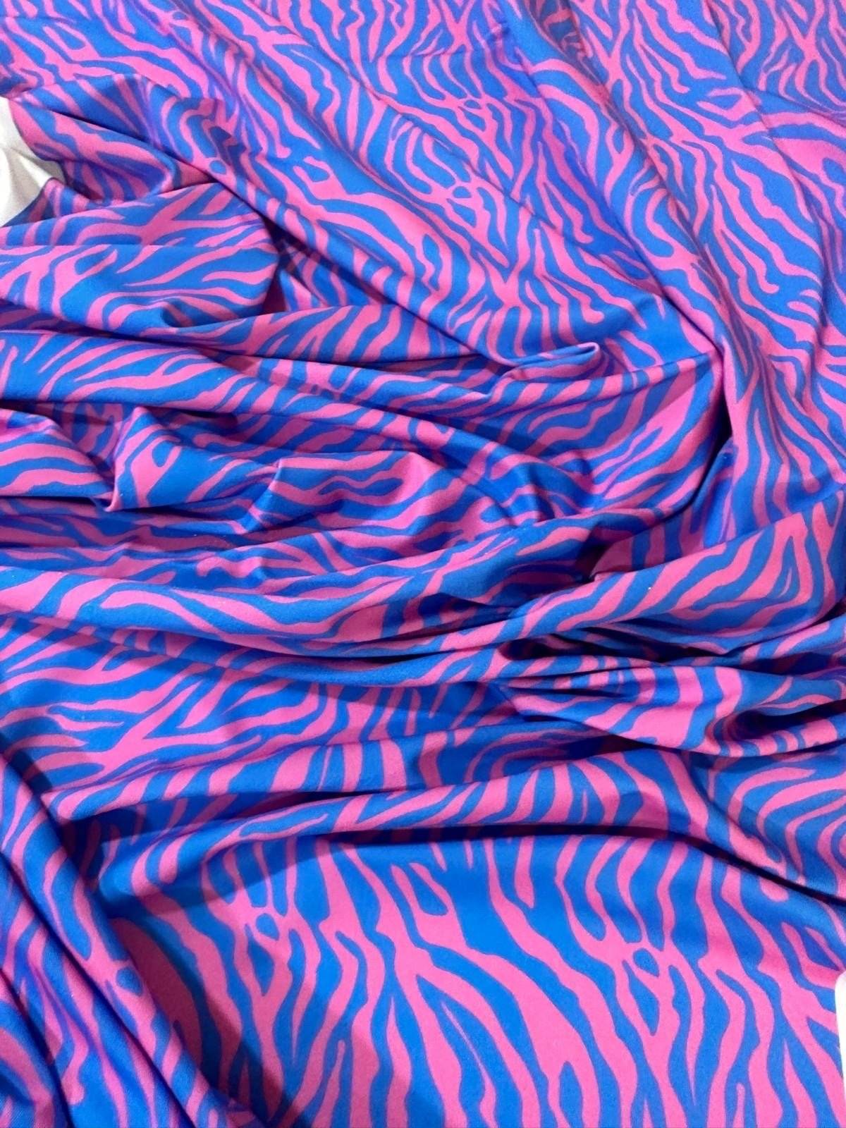 Blue and pink zebra pattern fabric with vibrant exotic animal print for sewing and crafts