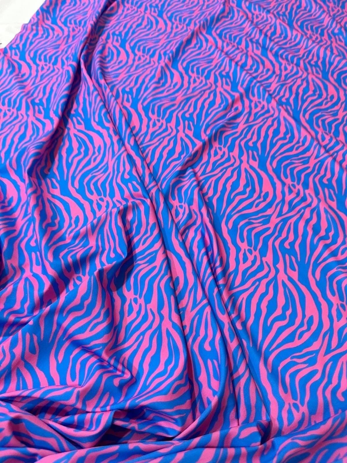 Blue and pink zebra pattern fabric with vibrant exotic animal print and 150cm width