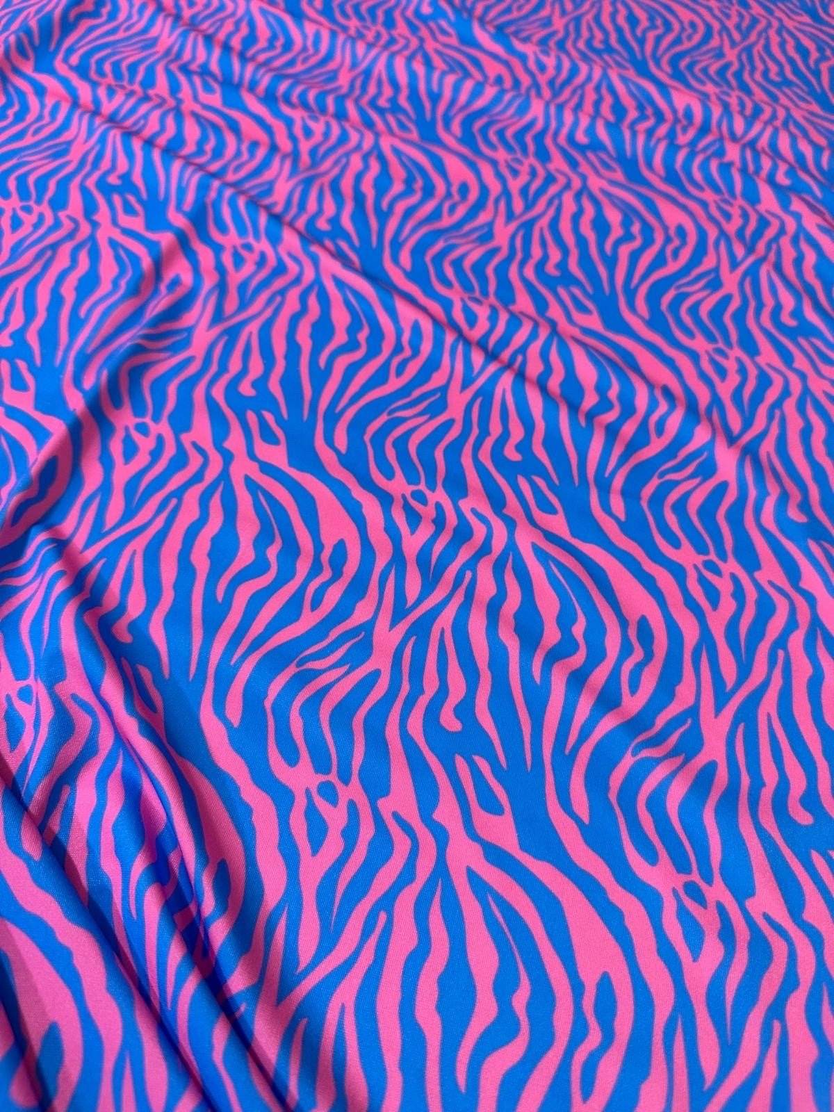 Blue and pink zebra pattern fabric with vibrant exotic animal print, 150cm wide, perfect for sewing and crafting projects