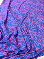 Blue and pink zebra pattern fabric with a vibrant exotic animal print, 150cm wide.
