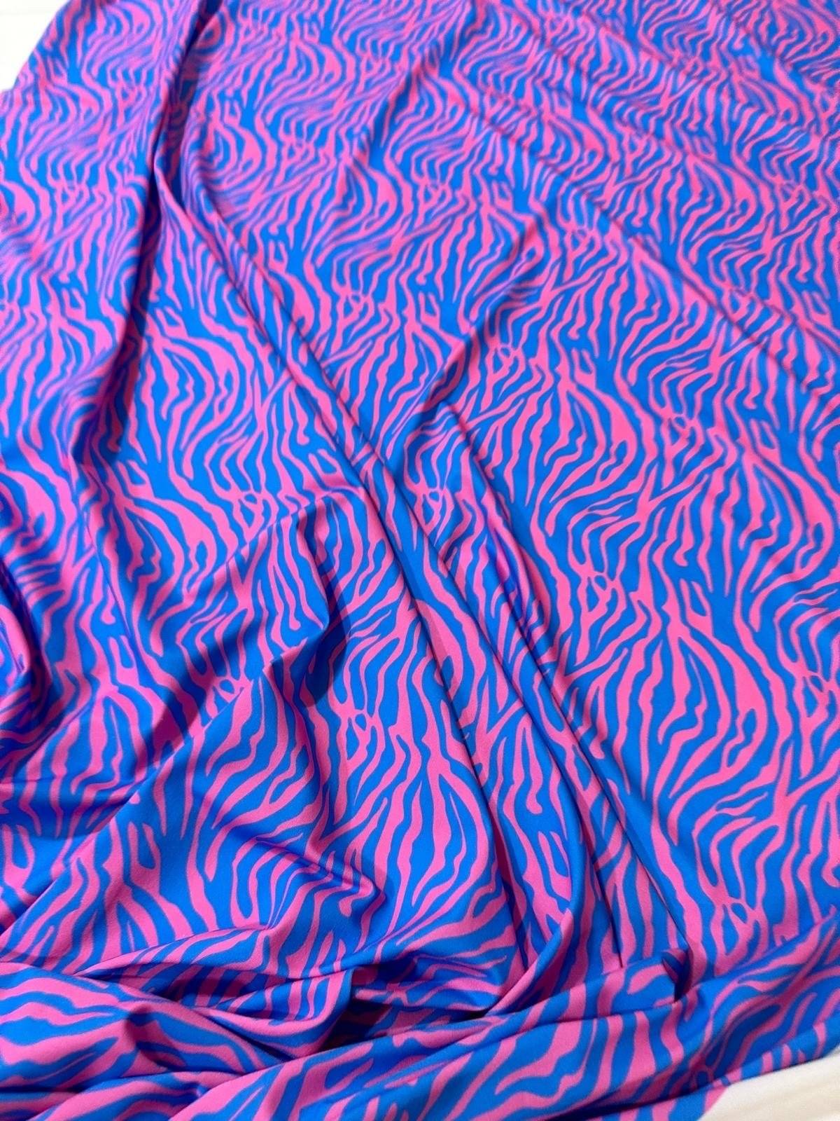 Blue and pink zebra pattern fabric with a vibrant exotic animal print, 150cm wide.