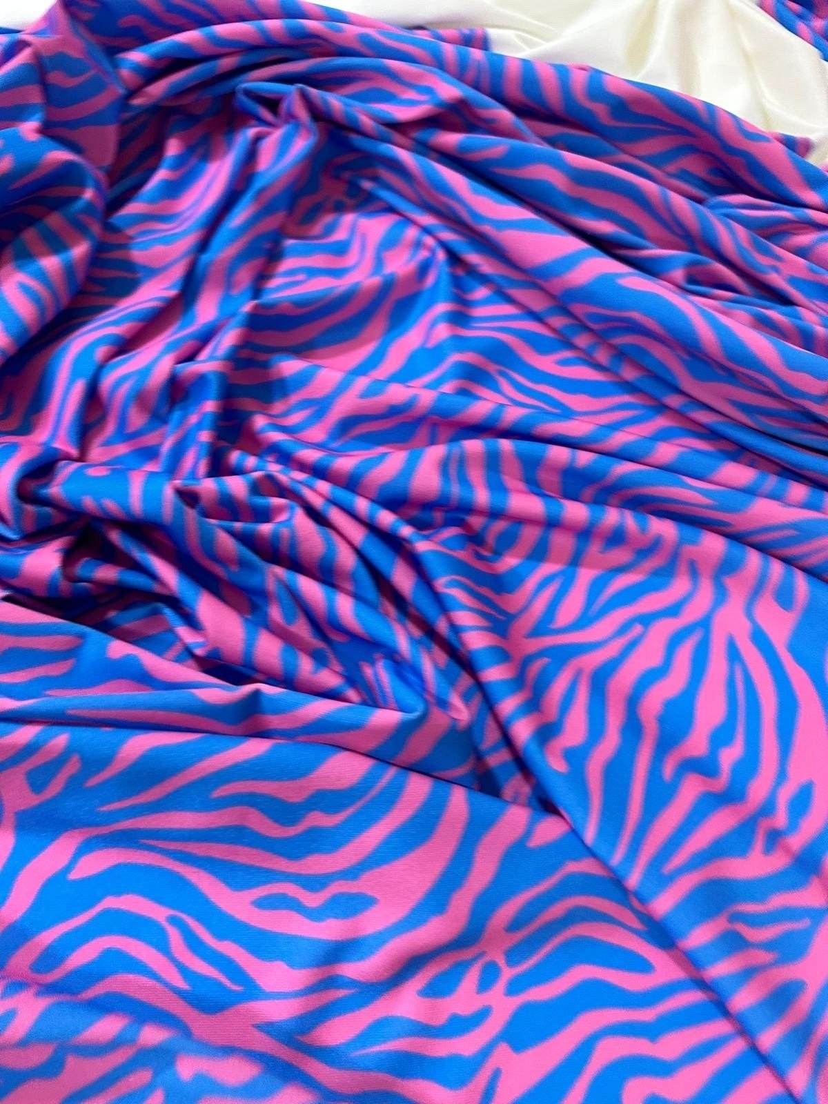 Blue and pink zebra pattern fabric with vibrant exotic animal print and 150cm width for sewing projects