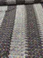 Black and white zigzag knit jersey fabric with colorful accents and chevron pattern