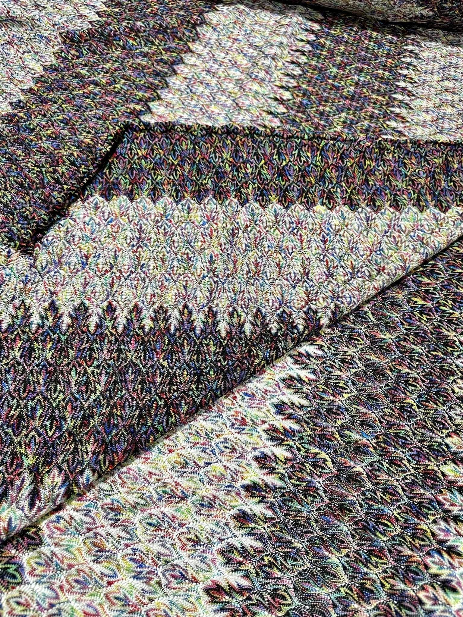 Black and white zigzag knit jersey fabric with luxury Italian chevron pattern and soft stretchy texture