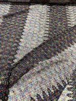 black and white zigzag knit jersey fabric with multicolor chevron pattern and soft texture