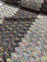 Black and white zigzag knit jersey fabric with chevron pattern and multicolor detailing, luxury Italian material, 150 cm wide, soft and stretchy texture