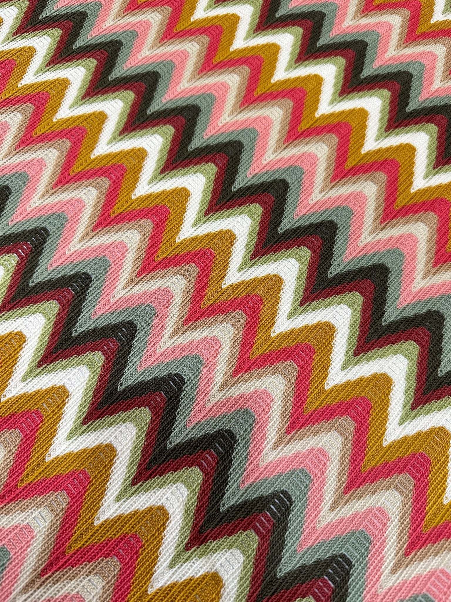 Luxury autumn chevron zigzag knit jersey fabric in warm fall colors with a bold pattern