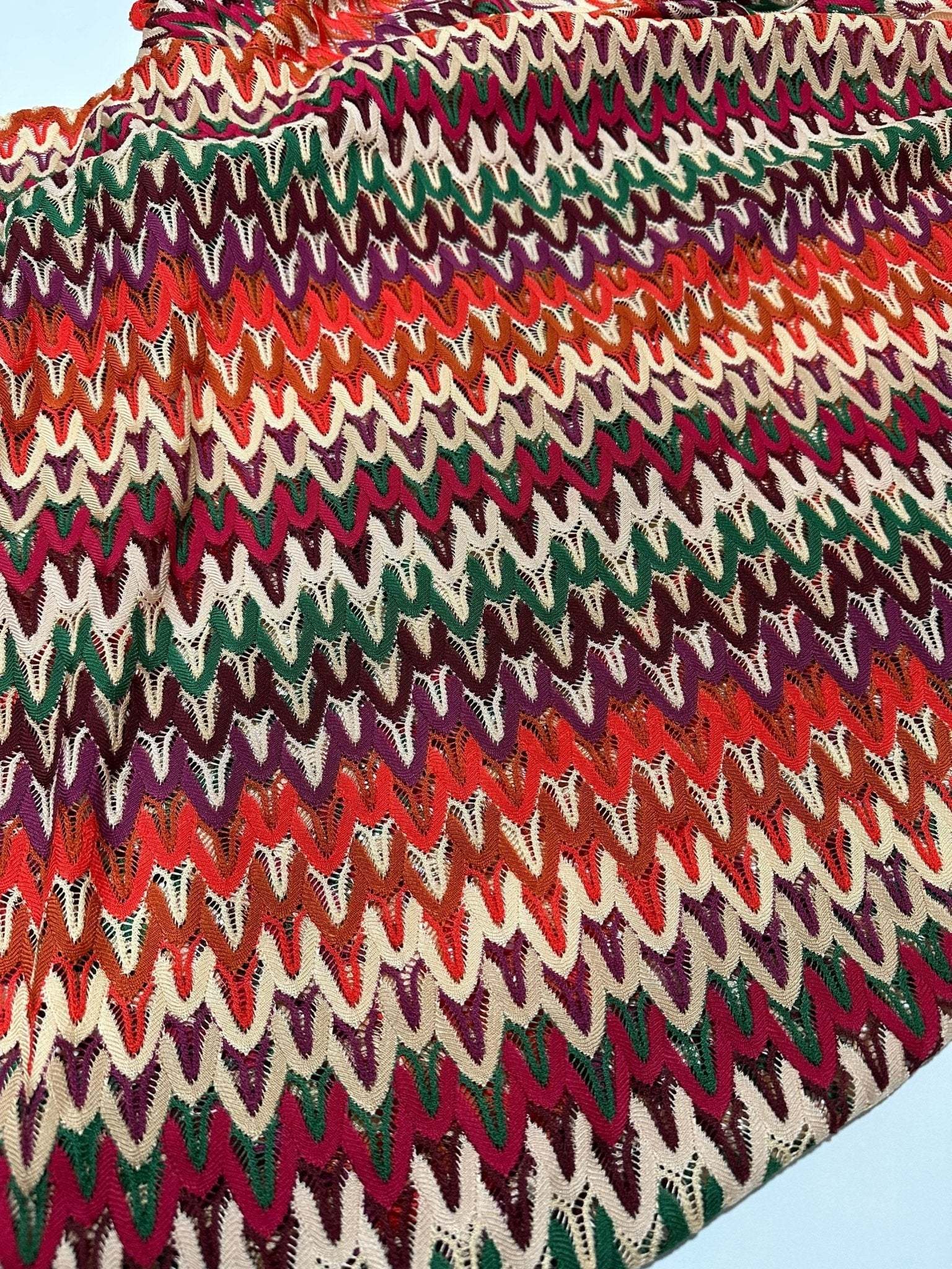 Multicolor chevron zigzag knit jersey fabric with vibrant colors and soft texture, 150cm wide.