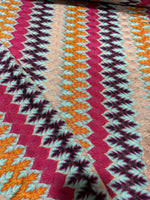 multicolor zigzag knit jersey fabric with chevron pattern in vibrant colors and soft texture