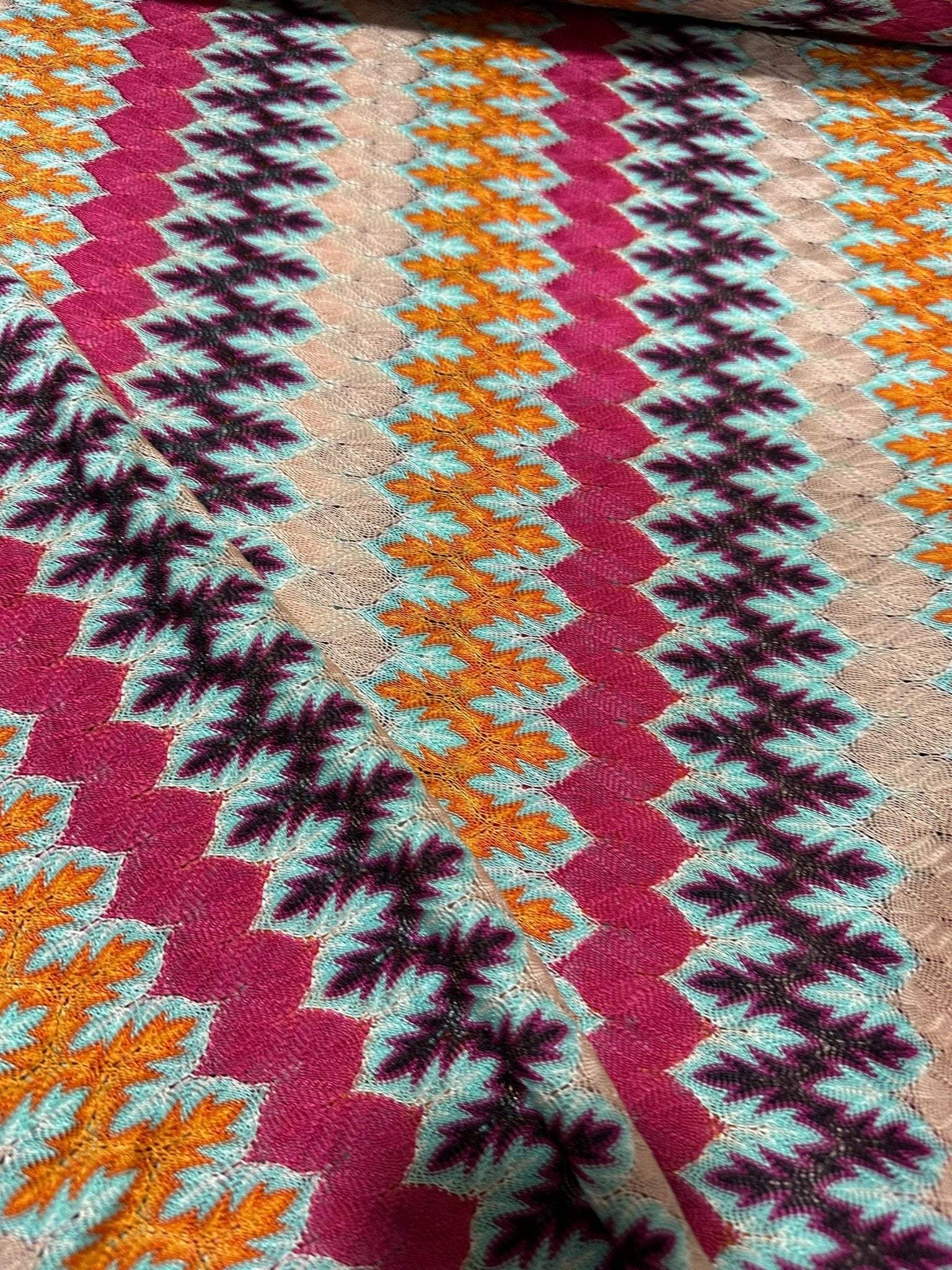 multicolor zigzag knit jersey fabric with chevron pattern in vibrant colors and soft texture