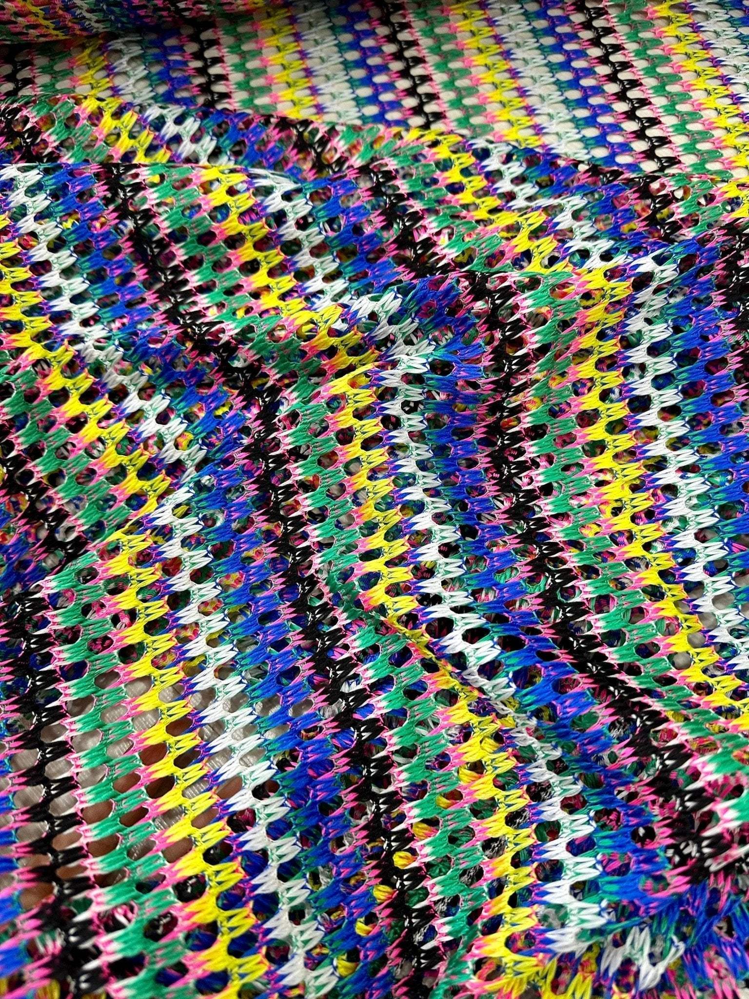 multicolor chevron zigzag knit jersey fabric with vibrant multicolor zigzag pattern and open knit texture