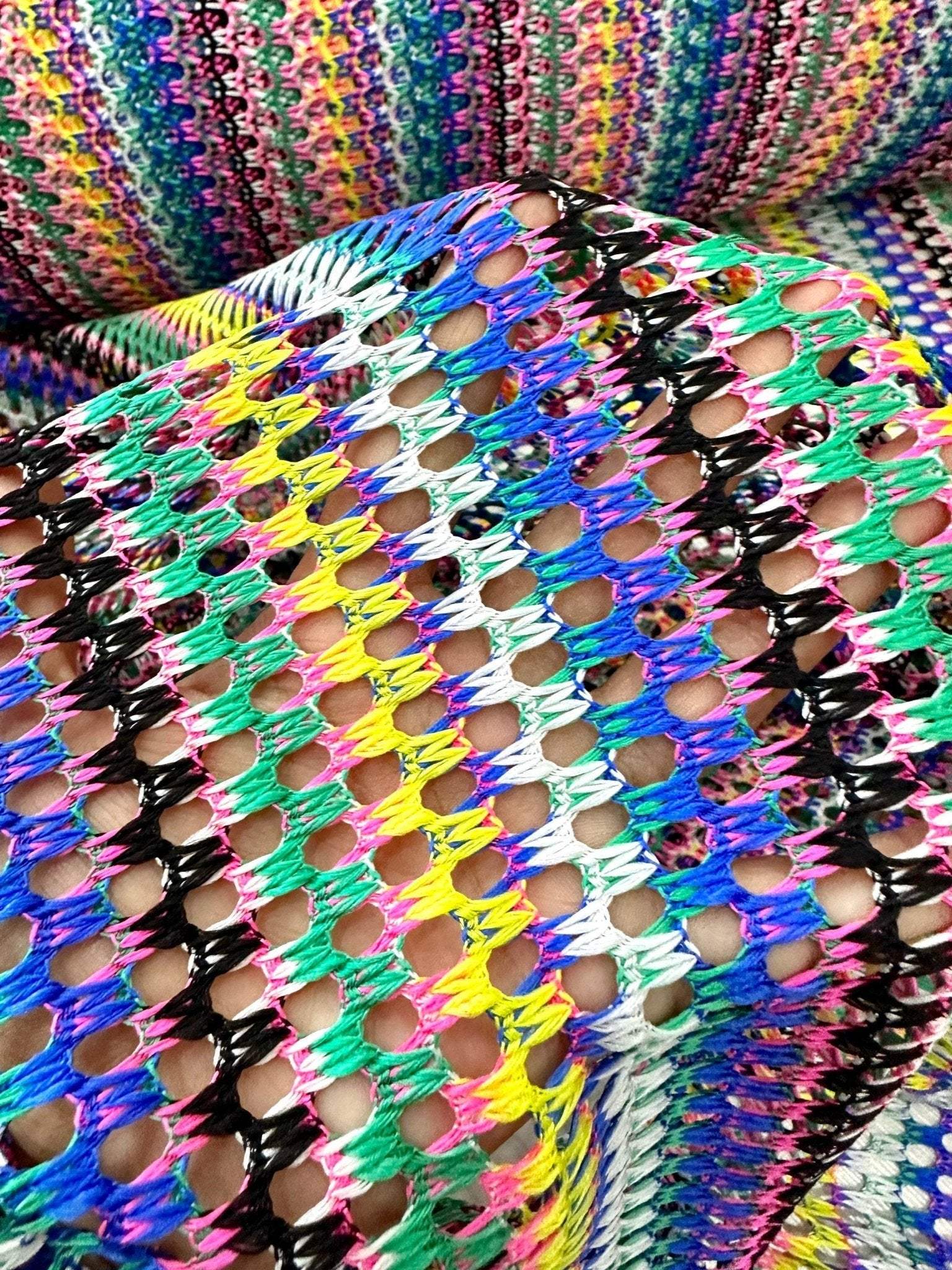 multicolor chevron zigzag knit jersey fabric with vibrant open knit pattern