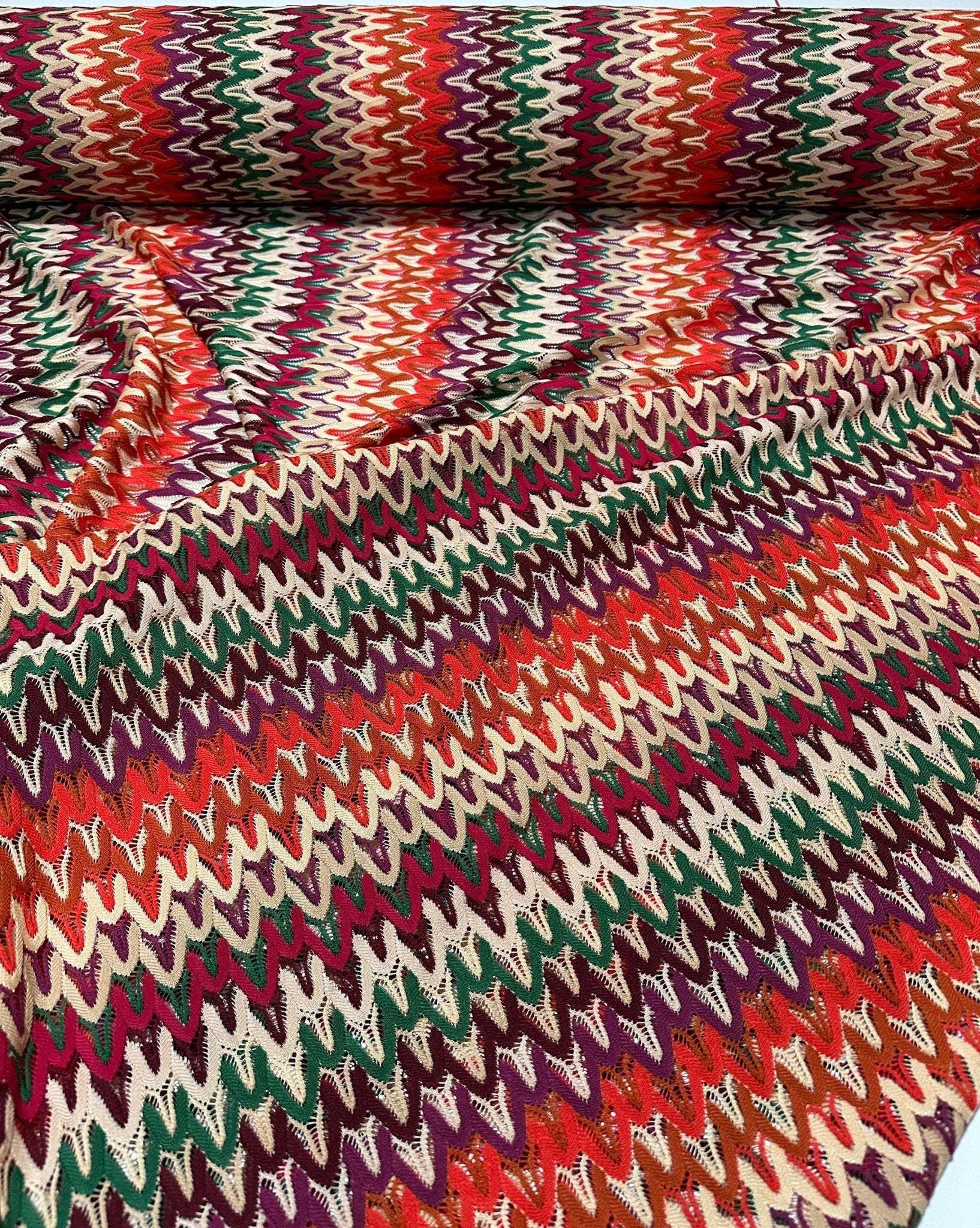Colorful zigzag knit jersey fabric with multicolor chevron pattern, 150cm wide, ideal for dresses, skirts, and blouses