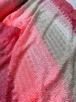 Chevron zigzag knit jersey fabric in pink and white pattern with soft texture and stretchy feel
