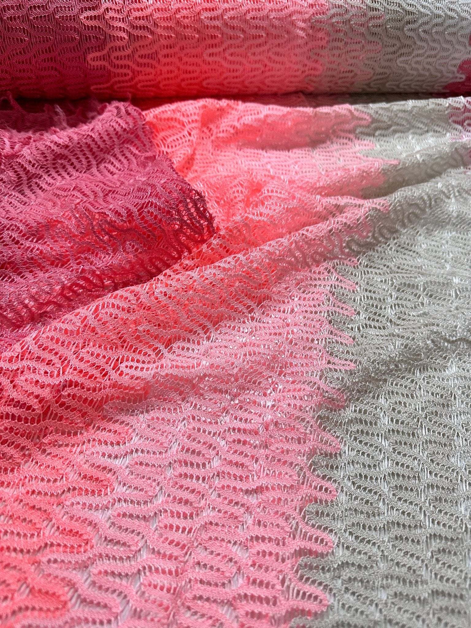 Pink and white chevron zigzag knit jersey fabric with textured pattern