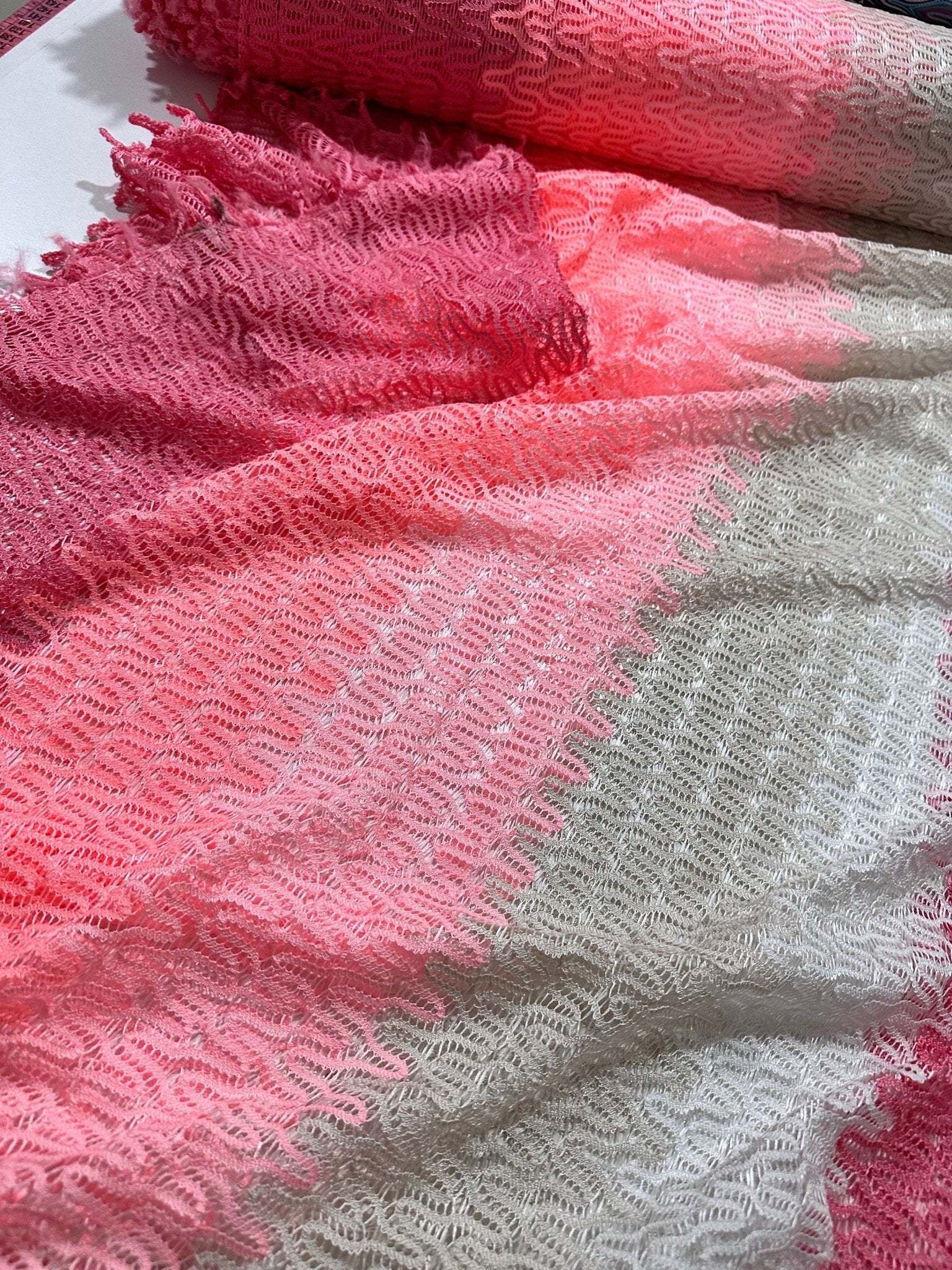 Pink and white chevron zigzag knit jersey fabric with textured pattern and soft feel, ideal for sewing garments