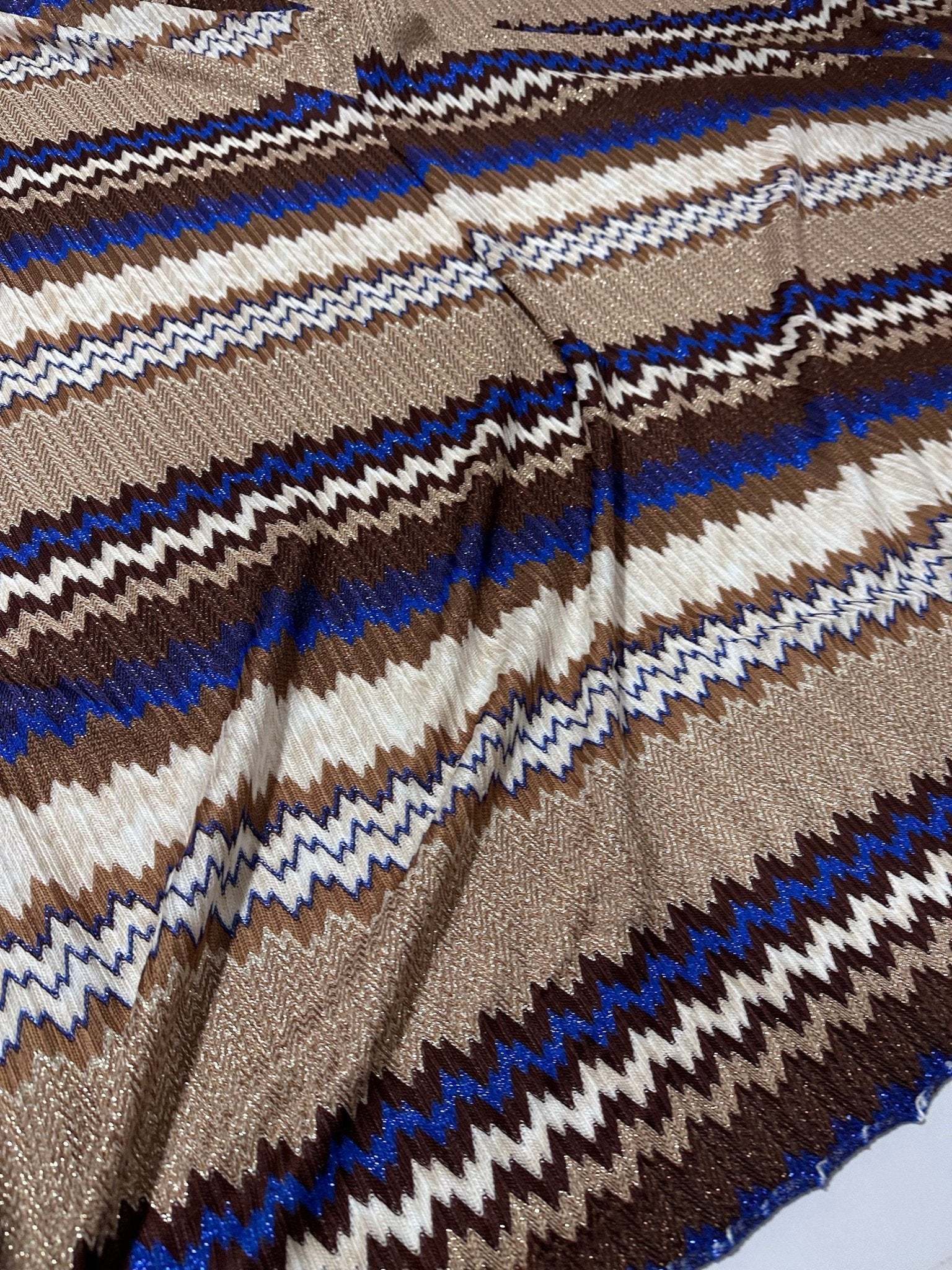 Shimmer brown zigzag knit mesh fabric with elastic jersey and blue, white, and beige pattern for fashion apparel