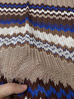 Shimmer brown zigzag knit mesh fabric with blue and cream accents, elastic and stretchy, suitable for fashion apparel.