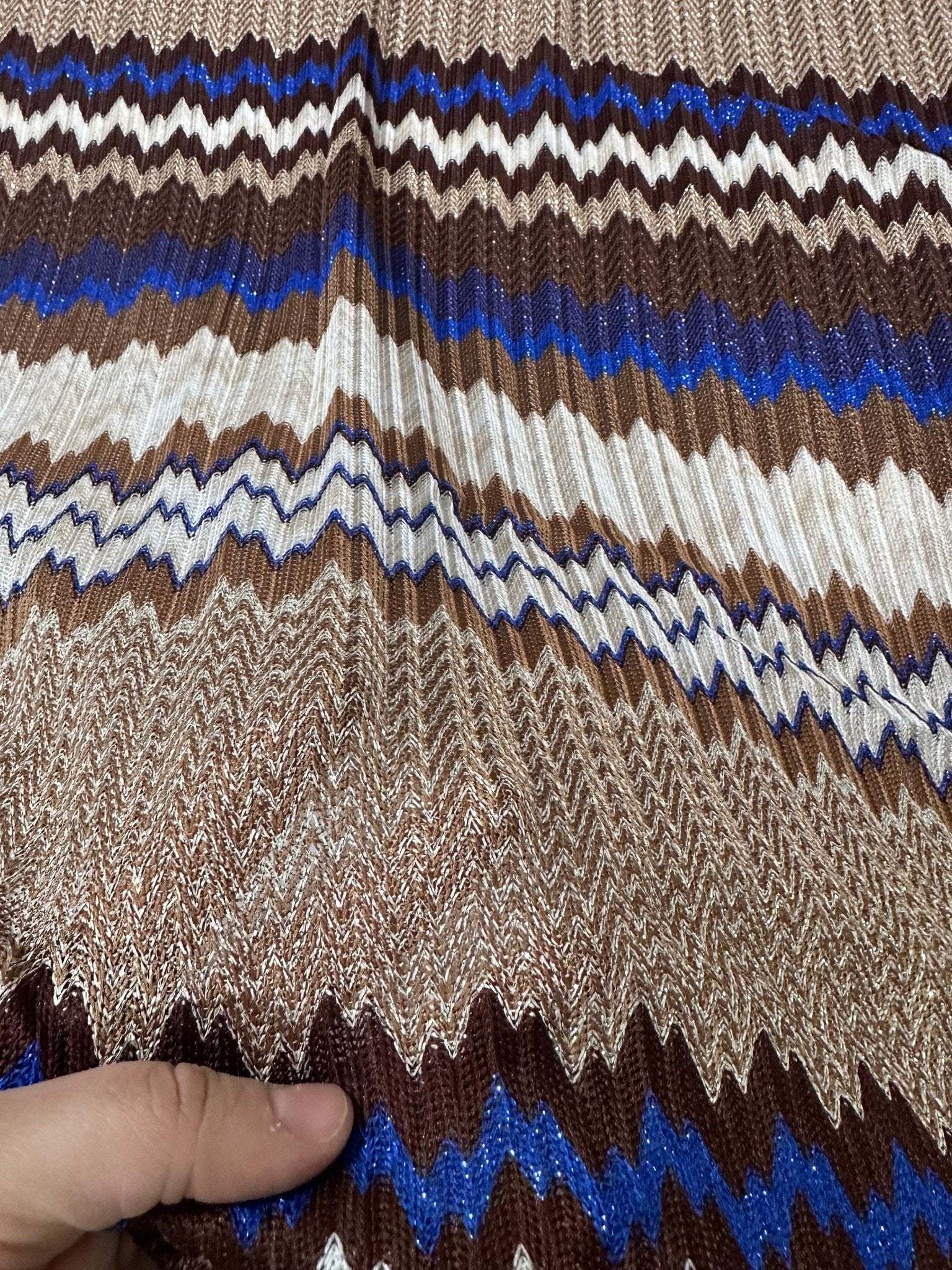 Shimmer brown zigzag knit mesh fabric with blue and cream accents, elastic and stretchy, suitable for fashion apparel.