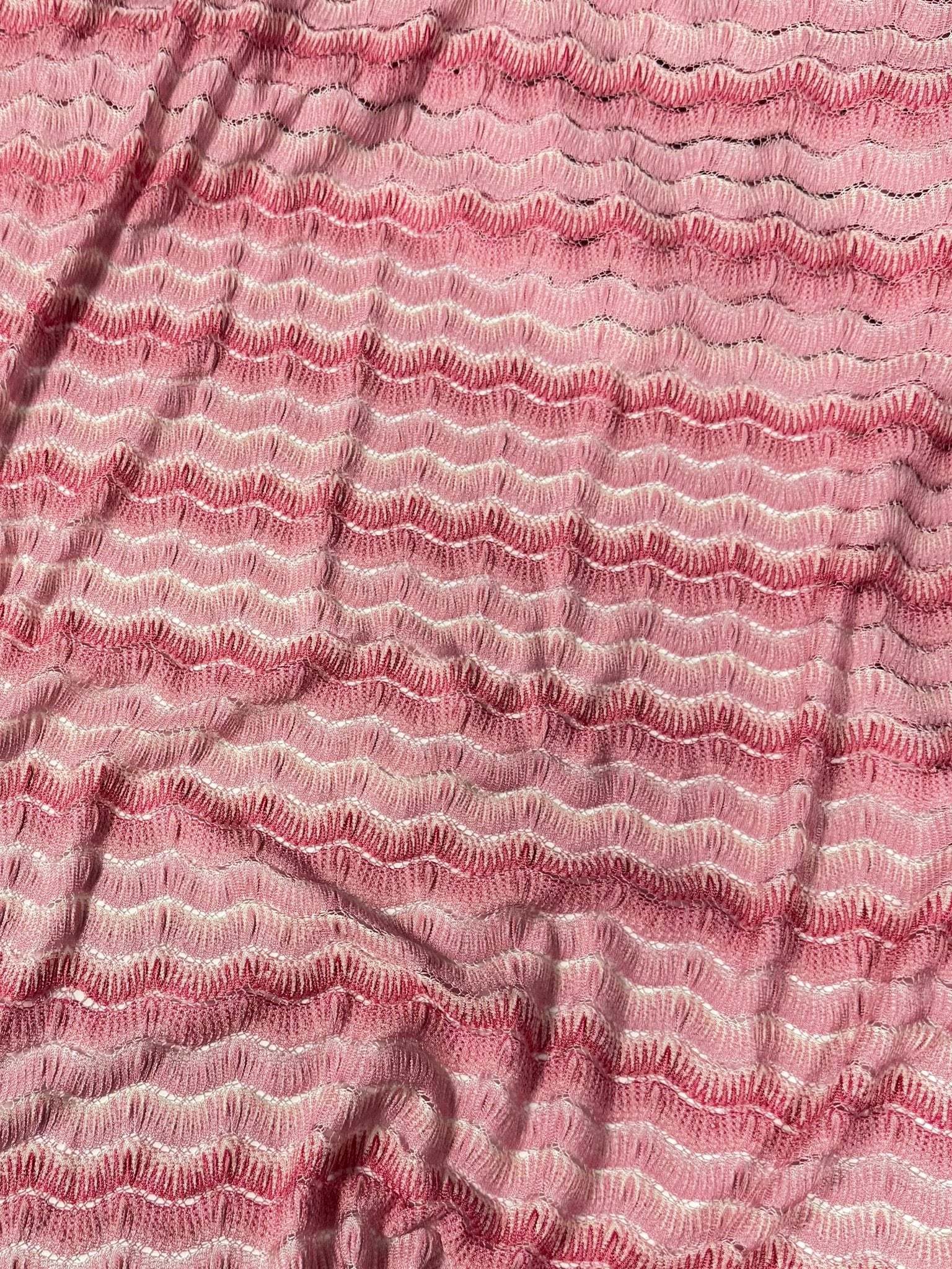 Pink tones zigzag mesh fabric with textured knit pattern and 150 cm width for sewing projects