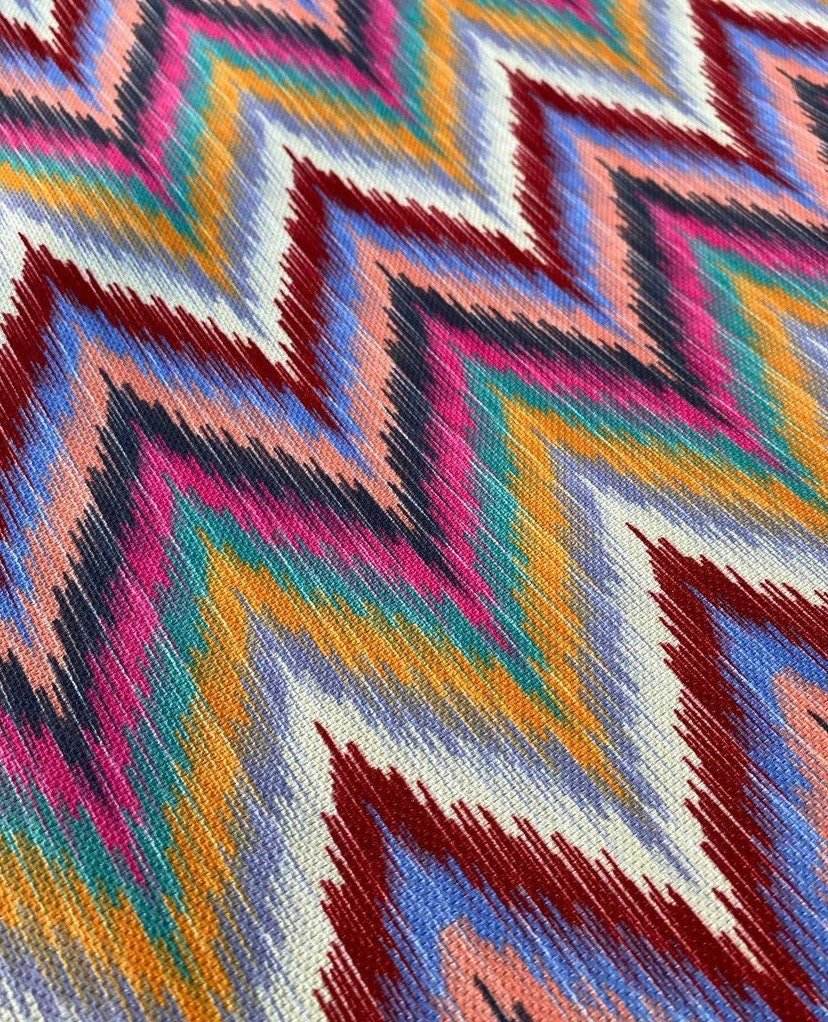 Close-up of vibrant zigzag chevron upholstery fabric with multicolor pattern